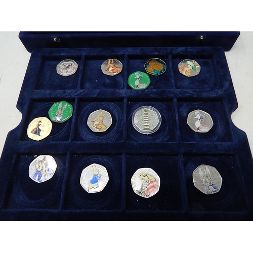 149 - A collection of 24 x Colourized 50 Pence coins housed in a Westminster 2-tray collectors box