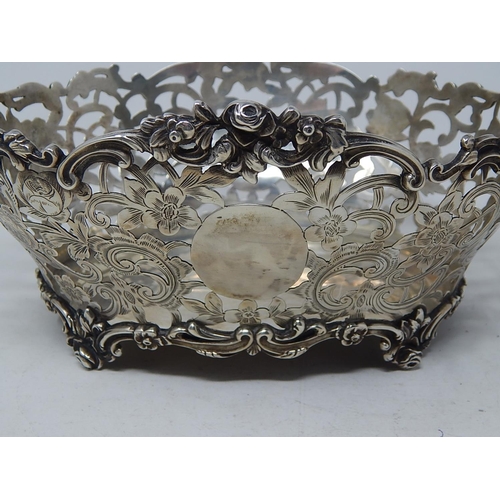 232 - Victorian Pierced Silver Bread Basket with rococo decoration & two blank cartouches: Hallmarked Lond... 