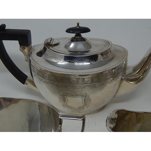 221 - Quantity of Silver Plated Wares to Include a Three Piece Tea Set, Claret Jug, Gravy Boat etc.