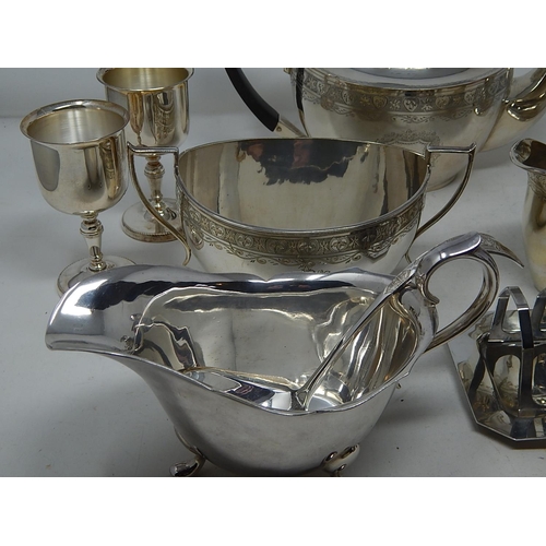 221 - Quantity of Silver Plated Wares to Include a Three Piece Tea Set, Claret Jug, Gravy Boat etc.