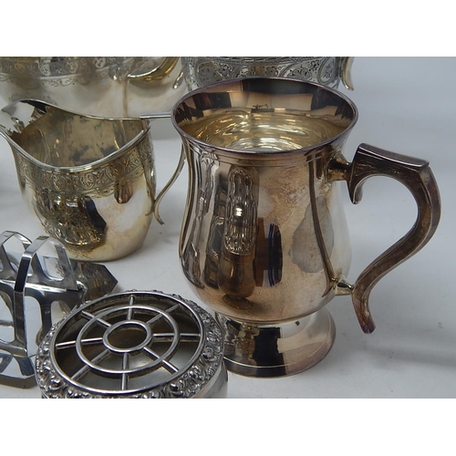 221 - Quantity of Silver Plated Wares to Include a Three Piece Tea Set, Claret Jug, Gravy Boat etc.