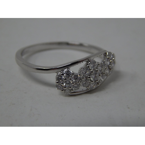 251 - 950 Platinum Diamond Set Flowerhead Ring: The Diamonds Totalling 0.5cts: Ring Size N: Gross weight 2... 