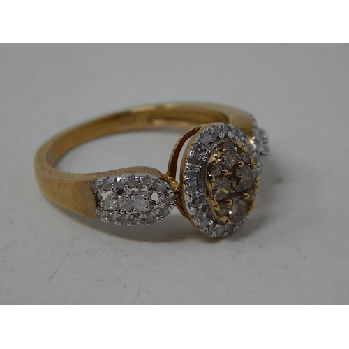 252 - 9ct Yellow Gold Ring Set with a Central Cluster of Yellow Diamonds within a Border of White Diamonds... 