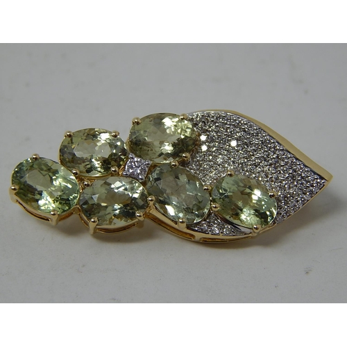 259 - 18ct Yellow Gold Brooch Set with Six Cuprian Tourmalines Estimated at 5.00cts with a Defining Centre... 