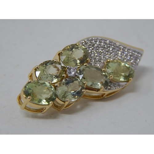 259 - 18ct Yellow Gold Brooch Set with Six Cuprian Tourmalines Estimated at 5.00cts with a Defining Centre... 