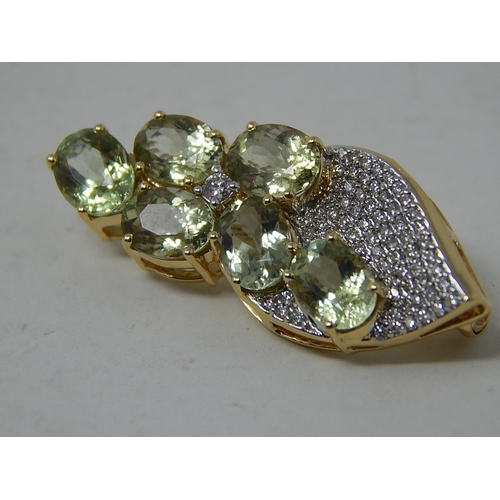 259 - 18ct Yellow Gold Brooch Set with Six Cuprian Tourmalines Estimated at 5.00cts with a Defining Centre... 