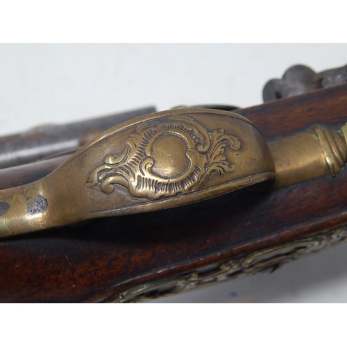 371 - A Fine Pair of C19th Continental Flintlock Pistols with Walnut Stocks & Brass Furnishings: Each Meas... 