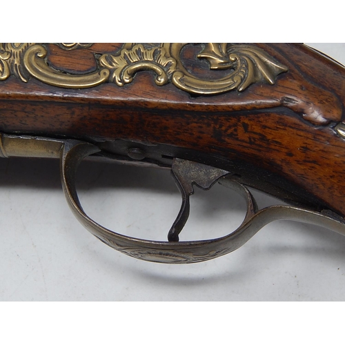 371 - A Fine Pair of C19th Continental Flintlock Pistols with Walnut Stocks & Brass Furnishings: Each Meas... 