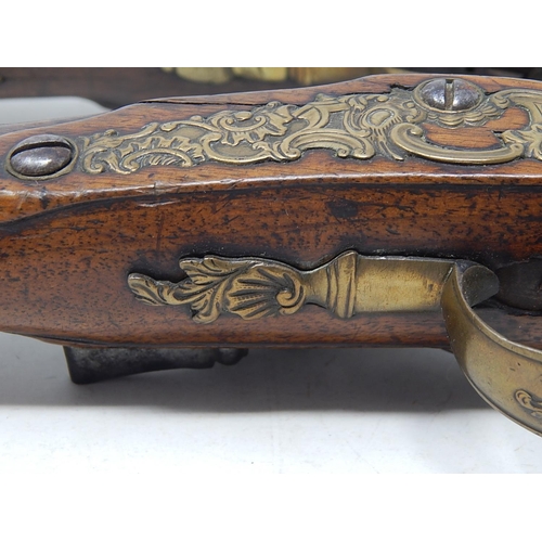 371 - A Fine Pair of C19th Continental Flintlock Pistols with Walnut Stocks & Brass Furnishings: Each Meas... 