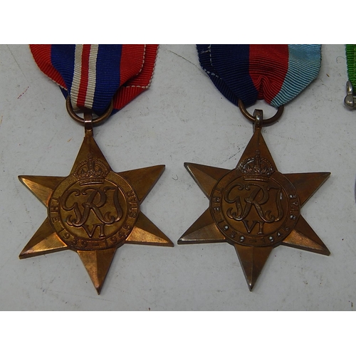 378 - WWII: Four Medals Comprising The Star 1945-1949 (2) together with The Victory Medal (2)