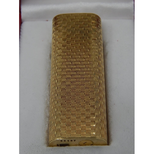 153 - CARTIER: 18ct Gold Lighter Stamped 750: Serial No: 66187: Gross weight 90g: In Red Cartier Box.