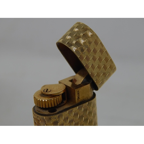 153 - CARTIER: 18ct Gold Lighter Stamped 750: Serial No: 66187: Gross weight 90g: In Red Cartier Box.