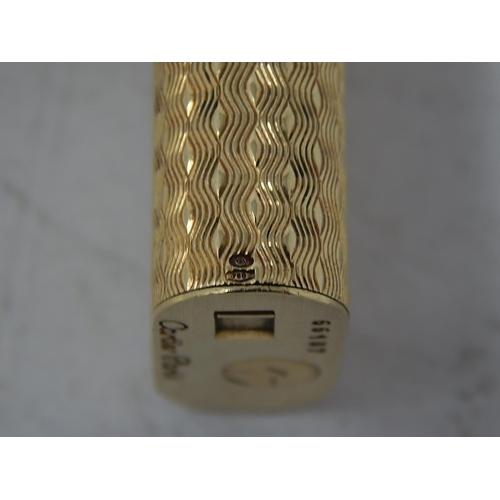 153 - CARTIER: 18ct Gold Lighter Stamped 750: Serial No: 66187: Gross weight 90g: In Red Cartier Box.