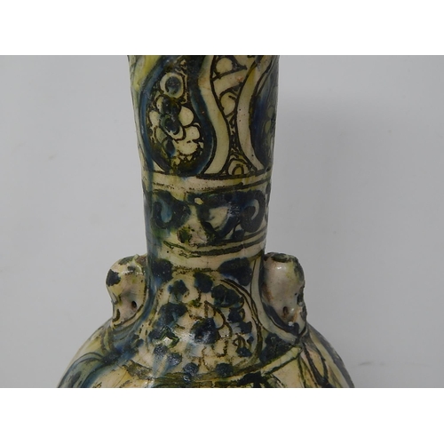 434 - Islamic bottle vase underglaze blue, yellow & green. 17thC or earlier. H 34cm