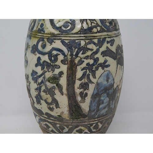 434 - Islamic bottle vase underglaze blue, yellow & green. 17thC or earlier. H 34cm