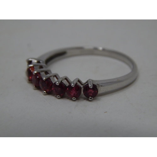 201 - 9ct White Gold Ring Set with 7 Rubies Estimated at 0.70cts: Ring Size N