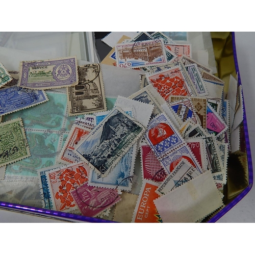 28 - Tin Containing a Large Assortment of UK & World Stamps.