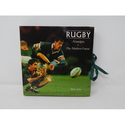 470 - Bronzed Sculpture of Two Rugby Players together with Two Rugby Nostalgia & Modern Play Books in Fold... 