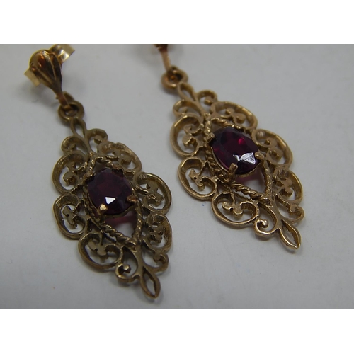 213 - 9ct Gold garnet set drop earrings. 463726