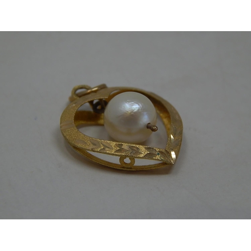 225 - 9ct gold pearl set pendant. 284979