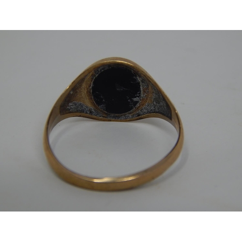 234 - 9ct gold onyx signet ring. 686261