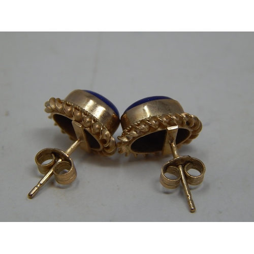 245 - 9ct gold lapis set studs. 219459