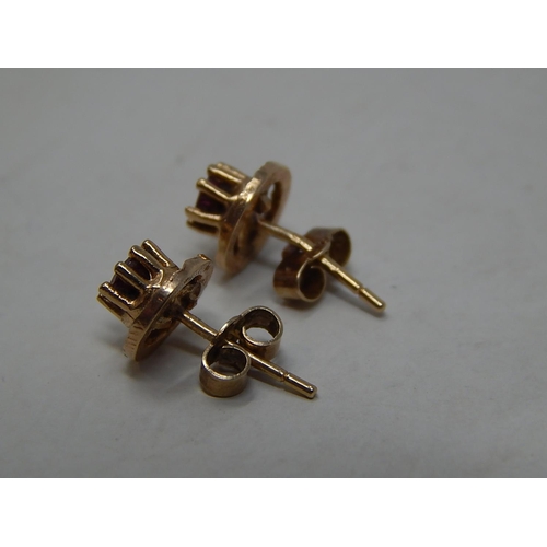 246 - 9ct gold garnet set stud earrings. 280303