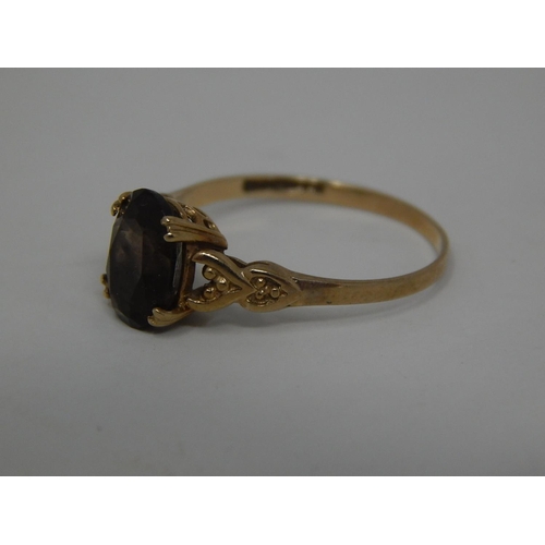 255 - 9ct gold smoky quartz set ring. 637669