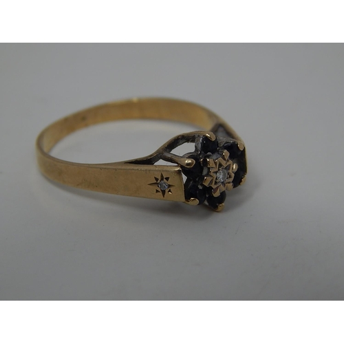 262 - 9ct gold diamond and sapphire set cluster ring. 422525