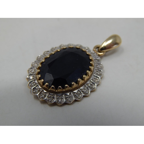 272 - 9ct gold diamond and sapphire set cluster pendant. 822034