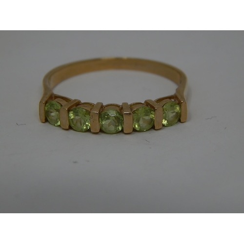 282 - 9ct gold peridot set half eternity ring. 359880