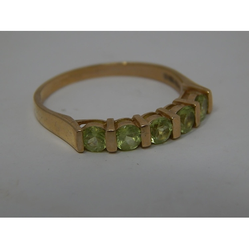 282 - 9ct gold peridot set half eternity ring. 359880