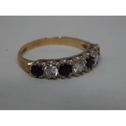 283 - 9ct gold gemstone set half eternity ring. 933327