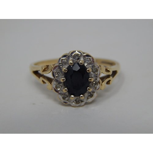 287 - 9ct gold diamond and sapphire set cluster ring. 915805