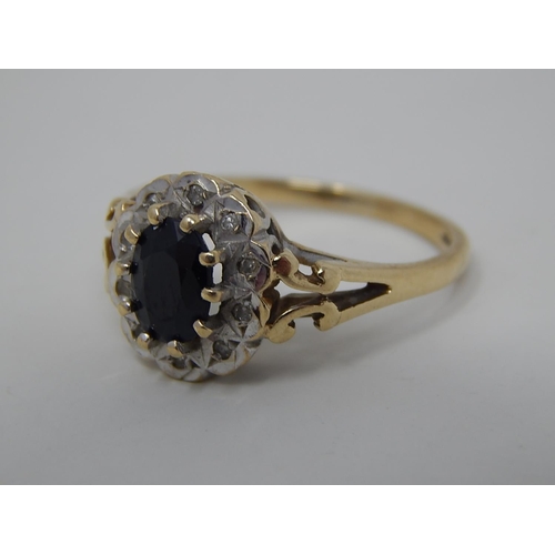 287 - 9ct gold diamond and sapphire set cluster ring. 915805