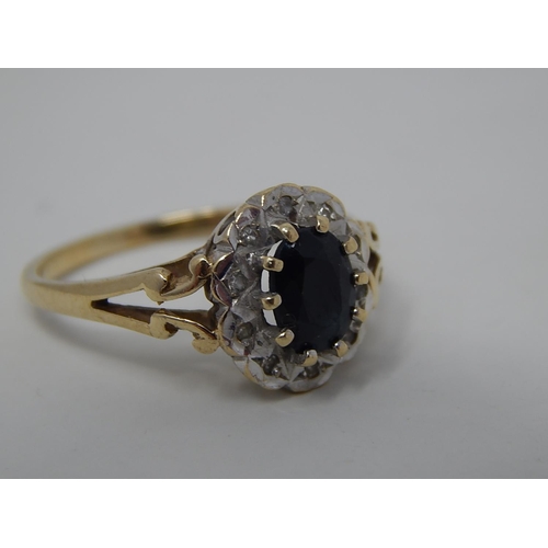 287 - 9ct gold diamond and sapphire set cluster ring. 915805