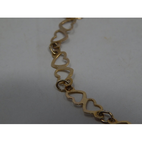 291 - 9ct gold heart link bracelet. 640802