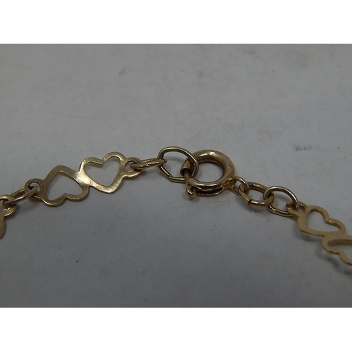 291 - 9ct gold heart link bracelet. 640802