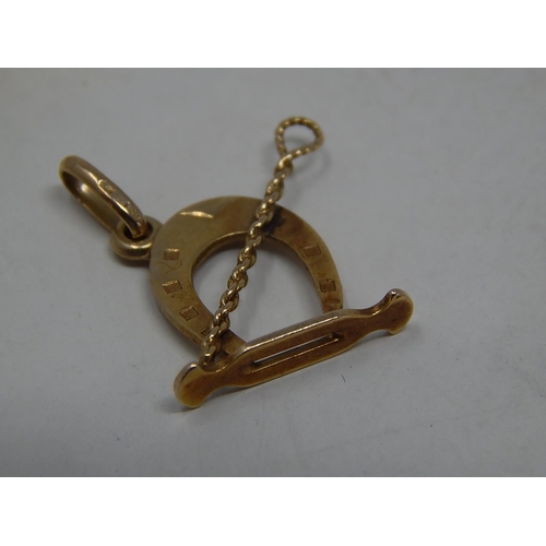 293 - 9ct gold horse riding charm. 225506