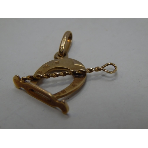 293 - 9ct gold horse riding charm. 225506