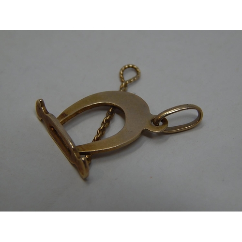 293 - 9ct gold horse riding charm. 225506