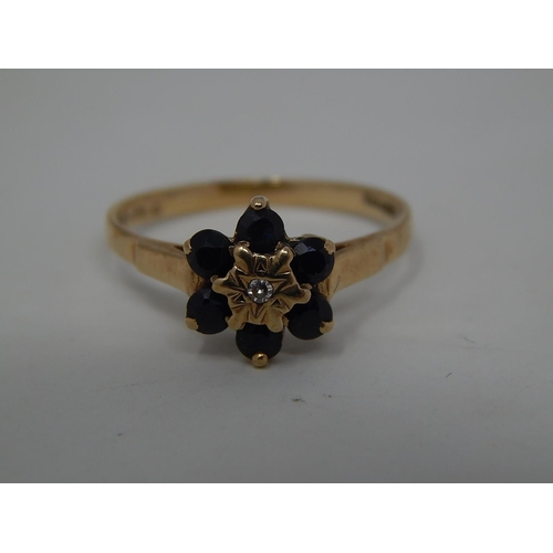 295 - 9ct gold diamond and sapphire cluster ring. 141382