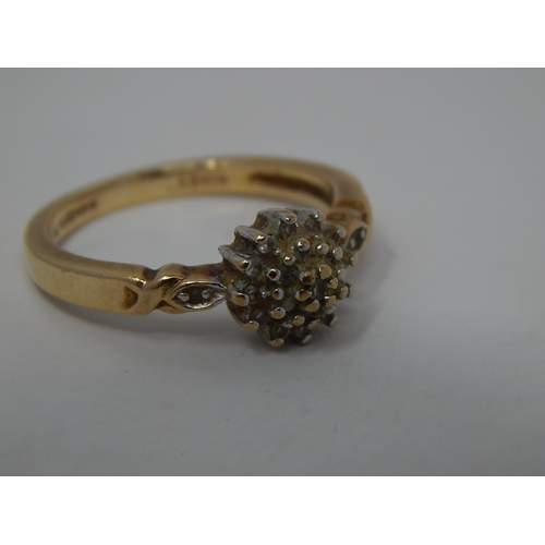 297 - 9ct gold diamond set cluster ring. 131171