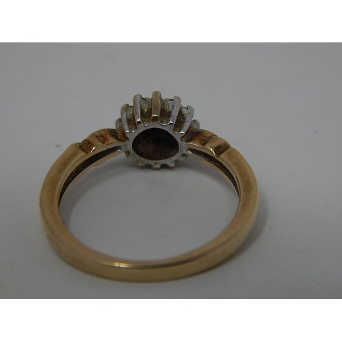 297 - 9ct gold diamond set cluster ring. 131171