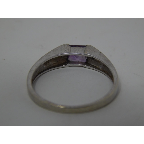 299 - 9ct gold diamond and amethyst set ring. 888182