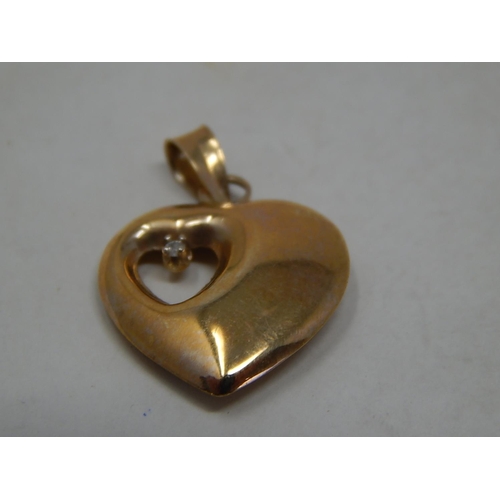 300 - 9ct gold diamond set heart pendant. 771355