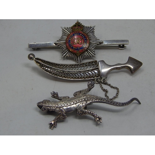 93 - 2 x Silver Brooches together with a silver military brooch.