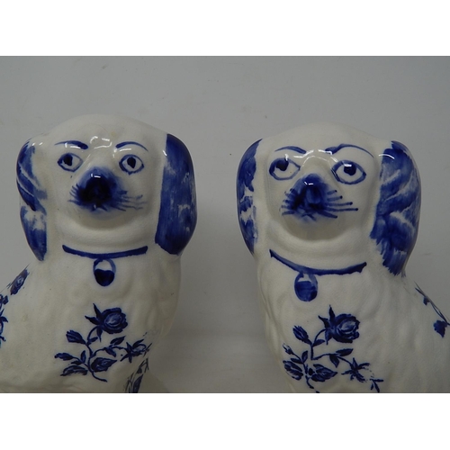 565 - Pair of Blue & White Staffordshire Dogs: Measuring 21cm high