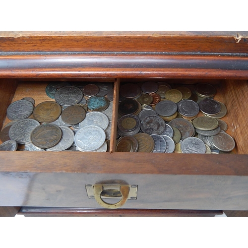 32 - A wooden 3-drawer collectors cabinet full of coinage of the World all unsorted/unchecked