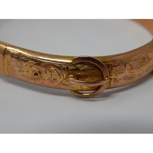 1 - 9ct Yellow Gold Hinged Bangle with Buckle Decoration: Weight 10.1g